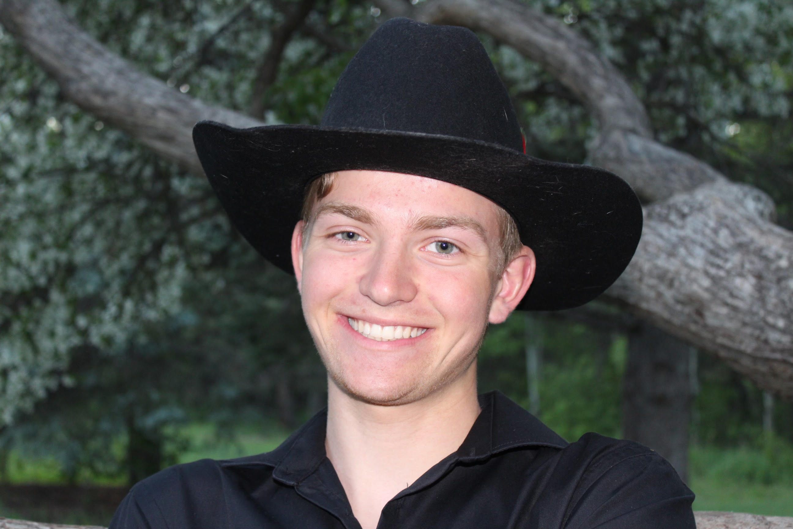 This is a head-shot of Adam on a fall evening at a local park.
